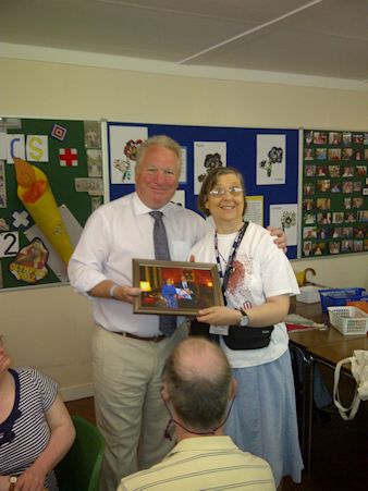 Mike Penning visits the Waterside Centre in Kings Langley to present a photo of user Anne Skidmore meeting the Prime Minister