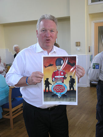 Mike with a limited print donated to Markyate by fundraiser Darren Heaton as he passed through the village on a sponsored walk.