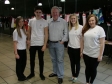 Mike with JFK creative media students at an exhibition of their art and design work